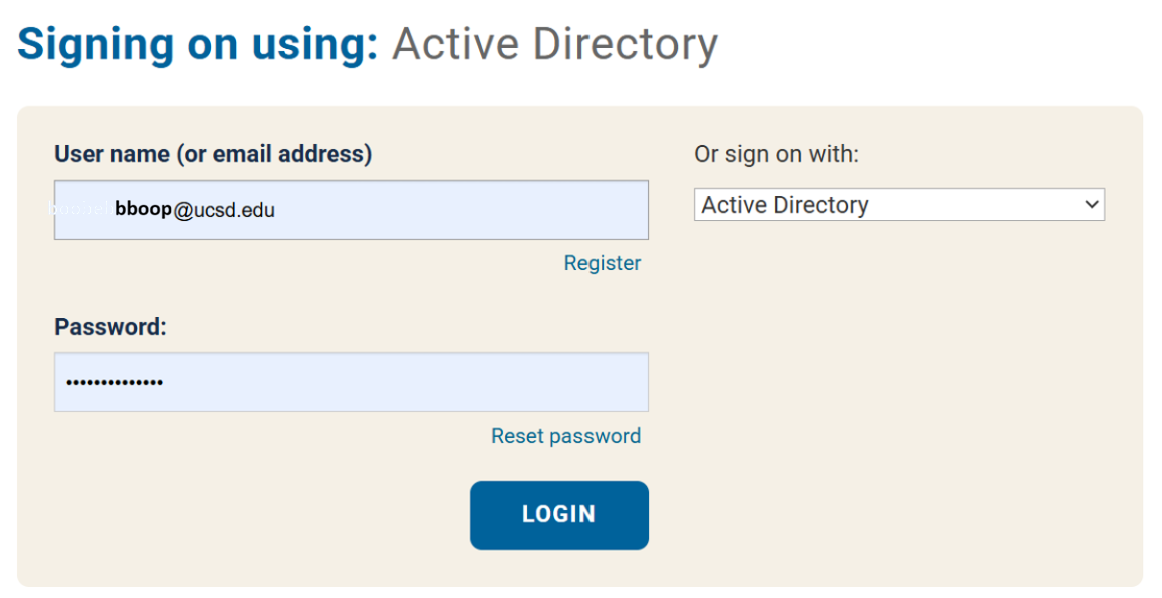 The Signing on using: Active Directory login page is displayed. The User name (or email address) field contains a UC San Diego email address, and the Password field is filled with masked characters. To the right, the "Or sign on with:" drop-down is set to Active Directory. A blue LOGIN button appears below the password field. Links to Register and Reset password are also available.